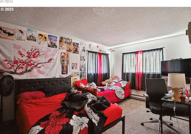 bedroom featuring carpet floors, a textured ceiling, and a baseboard heating unit