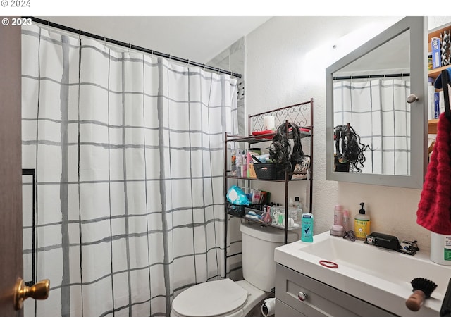 9630 SE Foster Rd, Portland, OR 97266 - bathroom with a textured wall, toilet, vanity, and a shower with curtain