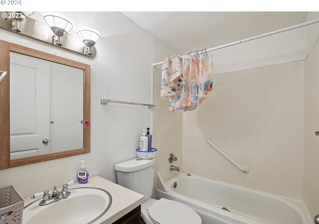 9630 SE Foster Rd, Portland, OR 97266 - bathroom featuring toilet, shower / bath combo, vanity, and a textured wall