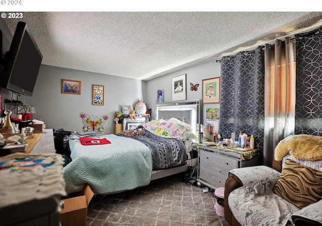 bedroom featuring a textured ceiling