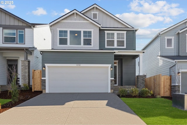 12785 SW Trask St, Beaverton, OR 97007 - craftsman inspired home featuring board and batten siding, an attached garage, driveway, and stone siding