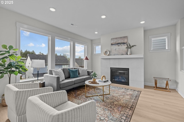 12785 SW Trask St, Beaverton, OR 97007 - living room featuring wood finished floors, a fireplace, recessed lighting, and baseboards