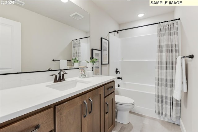 full bathroom with vanity, toilet, and shower / bath combo with shower curtain