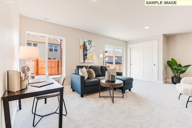 living room with light colored carpet