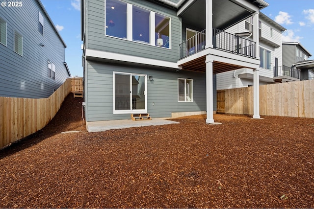 12785 SW Trask St, Beaverton, OR 97007 - back of property featuring a balcony and a fenced backyard