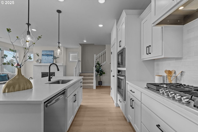 12785 SW Trask St, Beaverton, OR 97007 - kitchen with a sink, appliances with stainless steel finishes, light countertops, tasteful backsplash, and recessed lighting