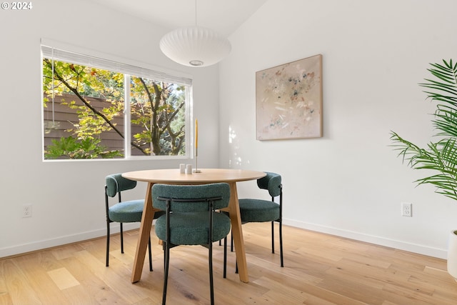 dining area with light hardwood / wood-style flooring