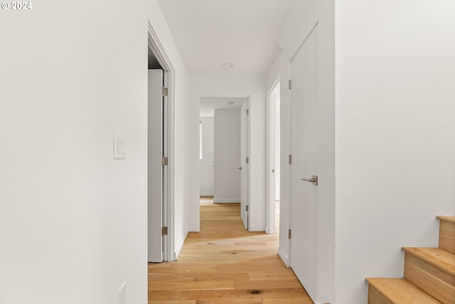 corridor with light wood-type flooring