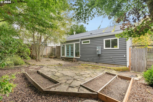 back of house with a patio area