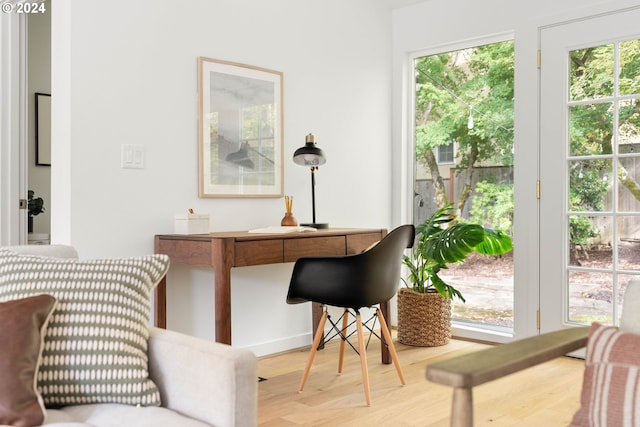 home office with hardwood / wood-style flooring