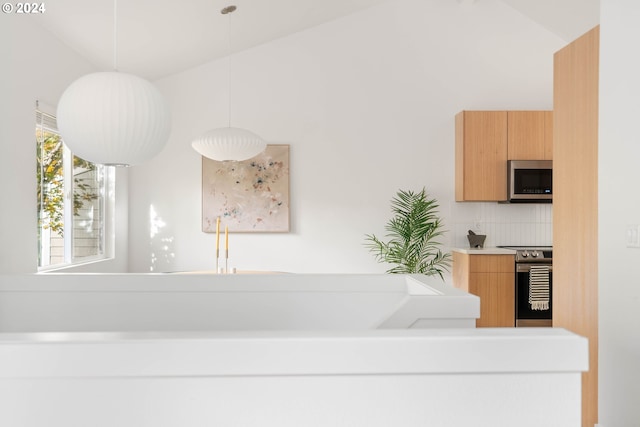 bathroom featuring decorative backsplash and vaulted ceiling