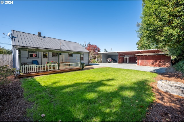 back of house with a lawn