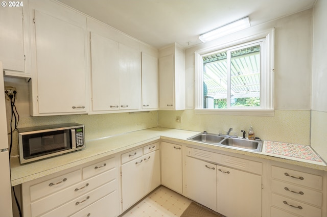 kitchen with white cabinets and sink