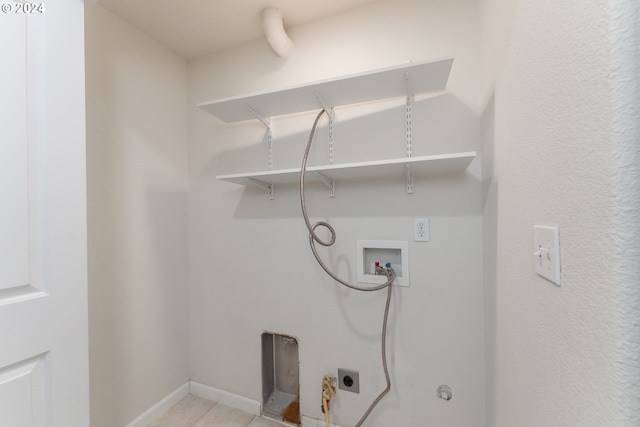 washroom with washer hookup, electric dryer hookup, and light tile patterned floors