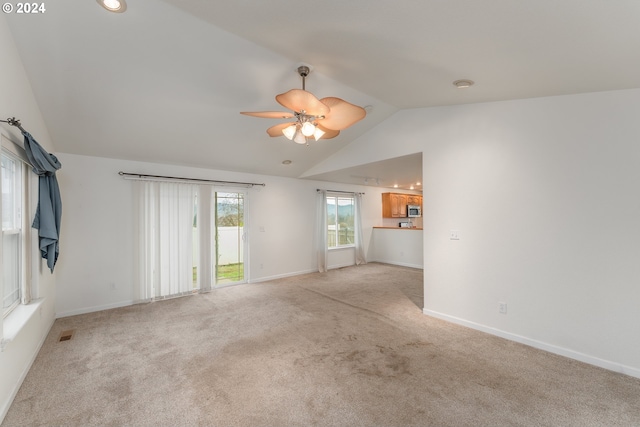 interior space featuring ceiling fan and lofted ceiling