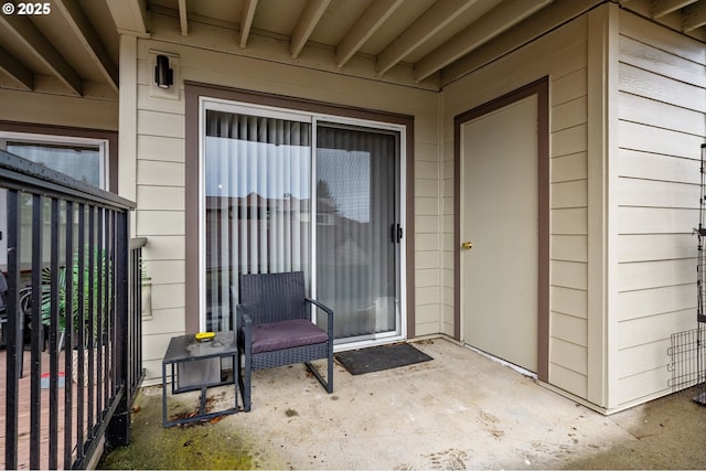 entrance to property with a patio