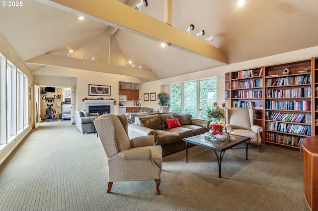 living room with beam ceiling, light carpet, and high vaulted ceiling