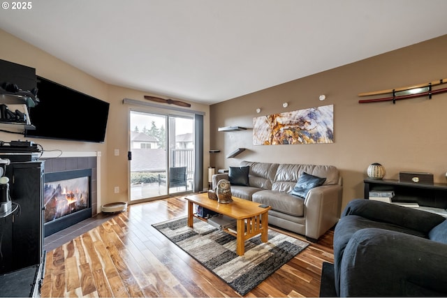 living room with a fireplace and light hardwood / wood-style floors