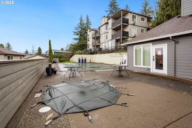 view of patio / terrace featuring a covered pool