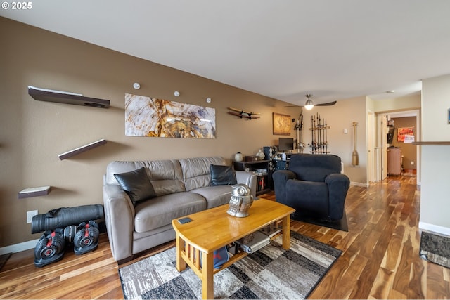 living room with hardwood / wood-style flooring and ceiling fan