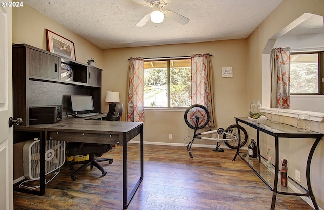 office space featuring ceiling fan, a textured ceiling, and wood-type flooring