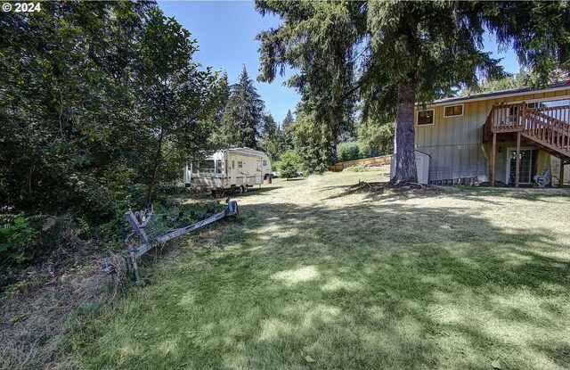 view of yard featuring a wooden deck