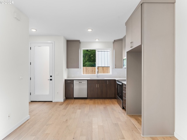 kitchen featuring light hardwood / wood-style floors, sink, and appliances with stainless steel finishes