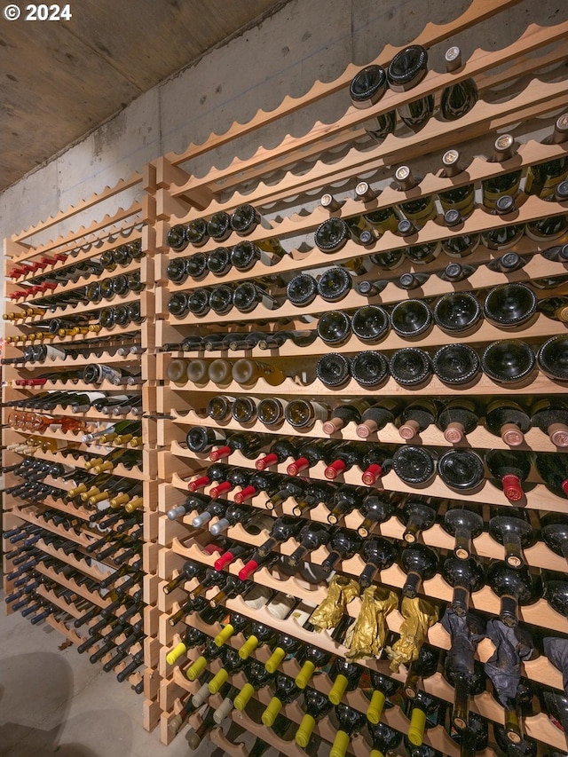 wine cellar featuring concrete floors