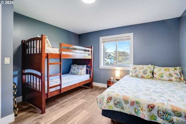 bedroom with hardwood / wood-style floors