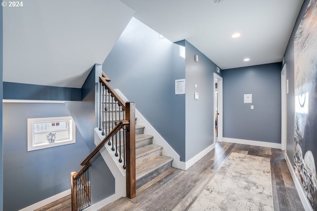 5545 NW Logan Rd, Lincoln City, OR 97367 - stairway with baseboards, recessed lighting, and wood finished floors