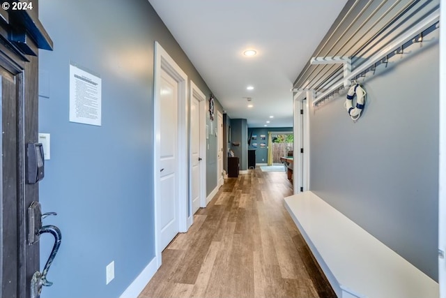 5545 NW Logan Rd, Lincoln City, OR 97367 - hallway with baseboards, recessed lighting, and light wood finished floors