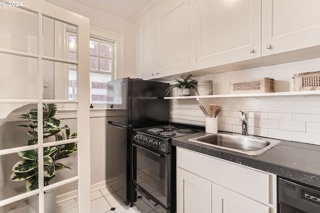 kitchen with sink, white cabinetry, black appliances, and light tile patterned flooring