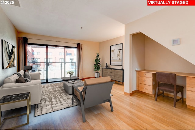 living room with light hardwood / wood-style flooring