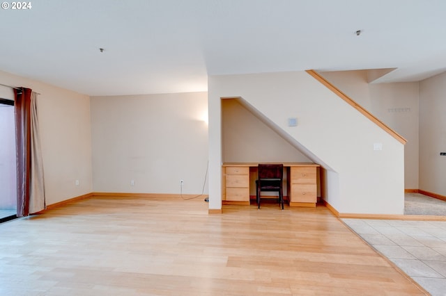 unfurnished living room with light hardwood / wood-style flooring