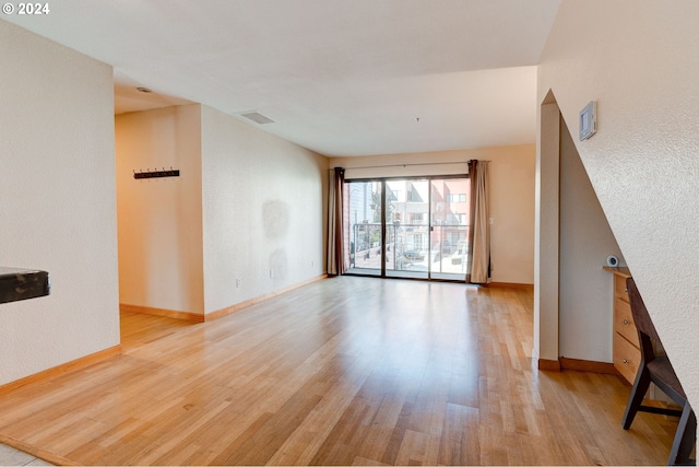 unfurnished living room with light hardwood / wood-style floors