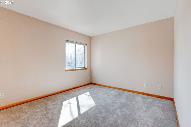 spare room featuring light wood-type flooring