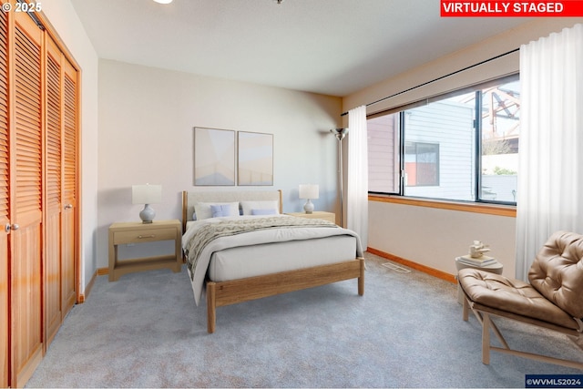 carpeted bedroom with a closet