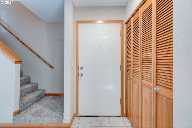 doorway featuring light tile patterned floors