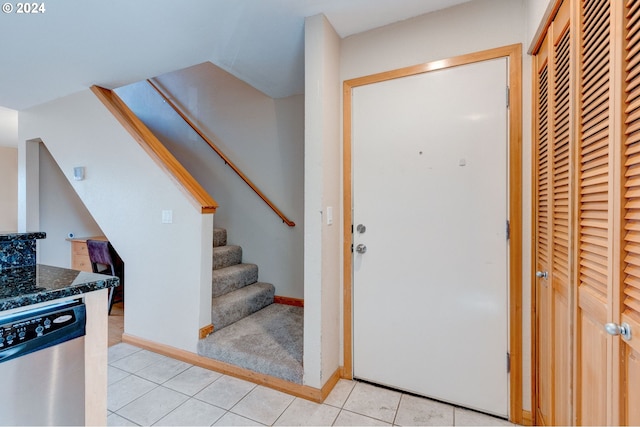 foyer with light tile patterned flooring