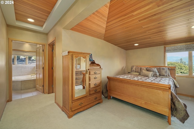 bedroom featuring light colored carpet, ensuite bath, and wood ceiling