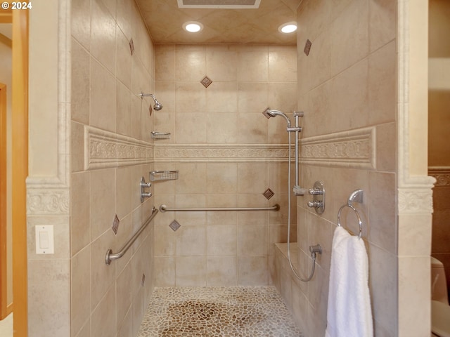 bathroom with tiled shower