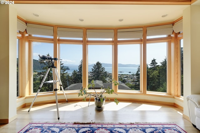 unfurnished sunroom featuring a mountain view