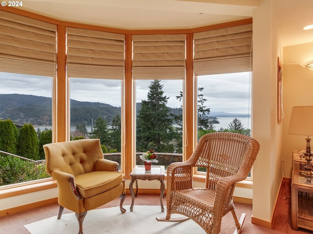 sunroom / solarium featuring a mountain view