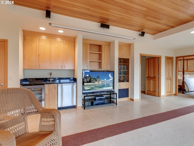 kitchen featuring wine cooler, stainless steel dishwasher, light brown cabinetry, light tile patterned floors, and wood ceiling