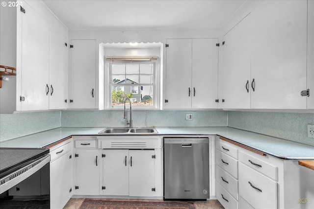 kitchen featuring white cabinets, stainless steel dishwasher, sink, and backsplash