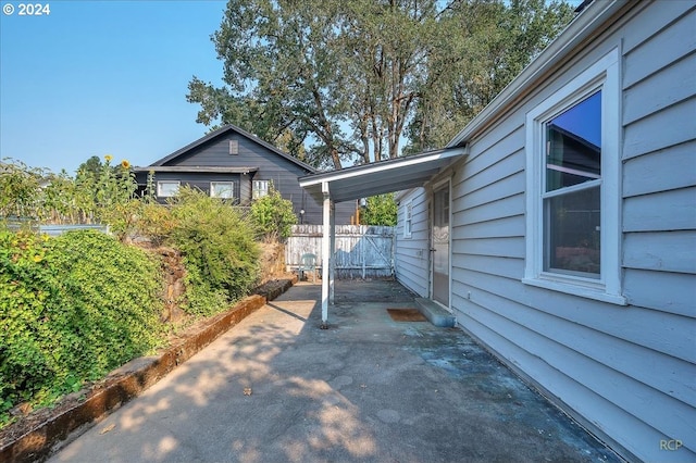 view of side of property with a patio area