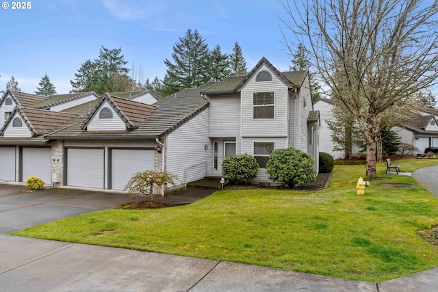 view of front property with a garage and a front yard