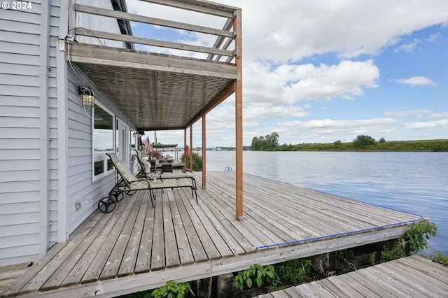 deck with a dock and a water view