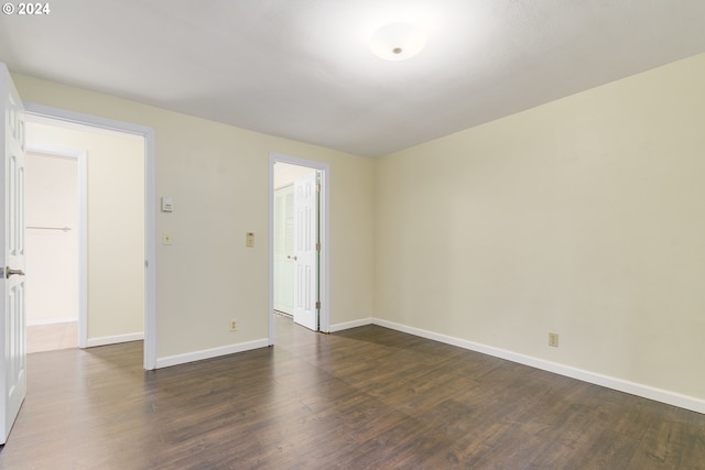 empty room featuring dark hardwood / wood-style floors