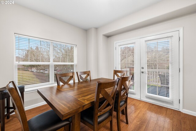 dining area with hardwood / wood-style floors